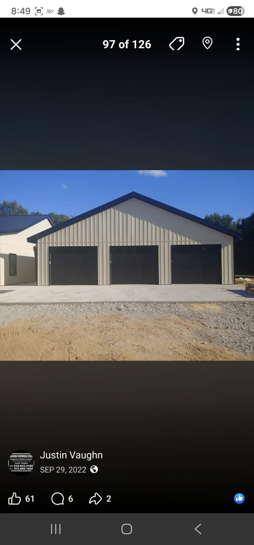 Commercial building with three black overhead bay doors