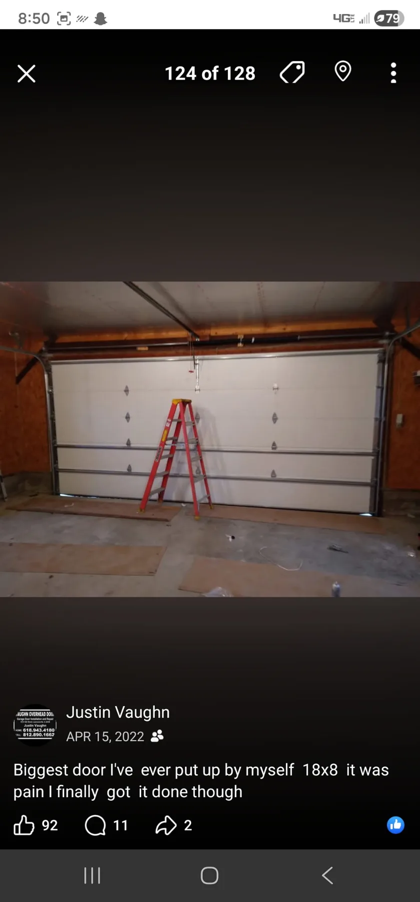 Garage door installation in progress with ladder in an interior bay