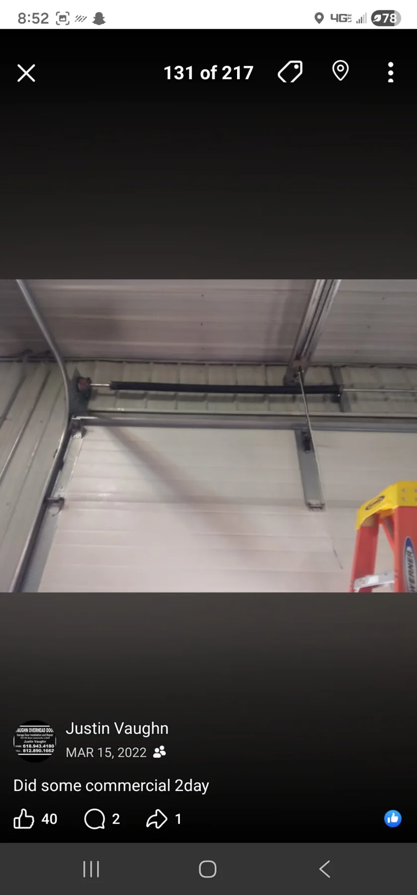 Low-headroom interior garage door track and support configuration