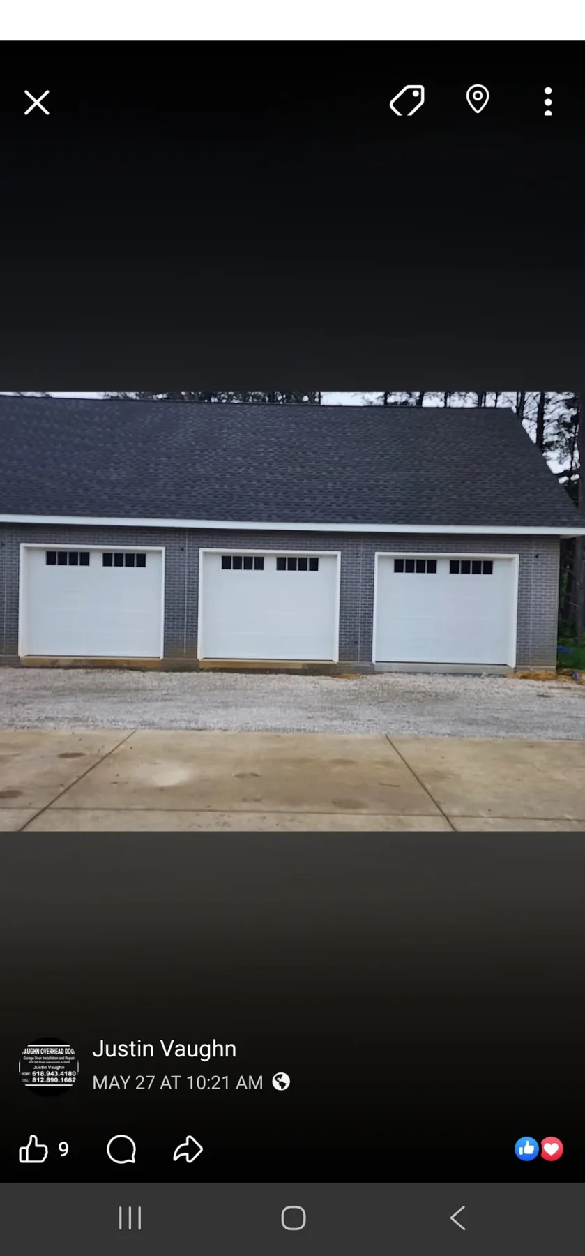 Residential property with three white garage doors
